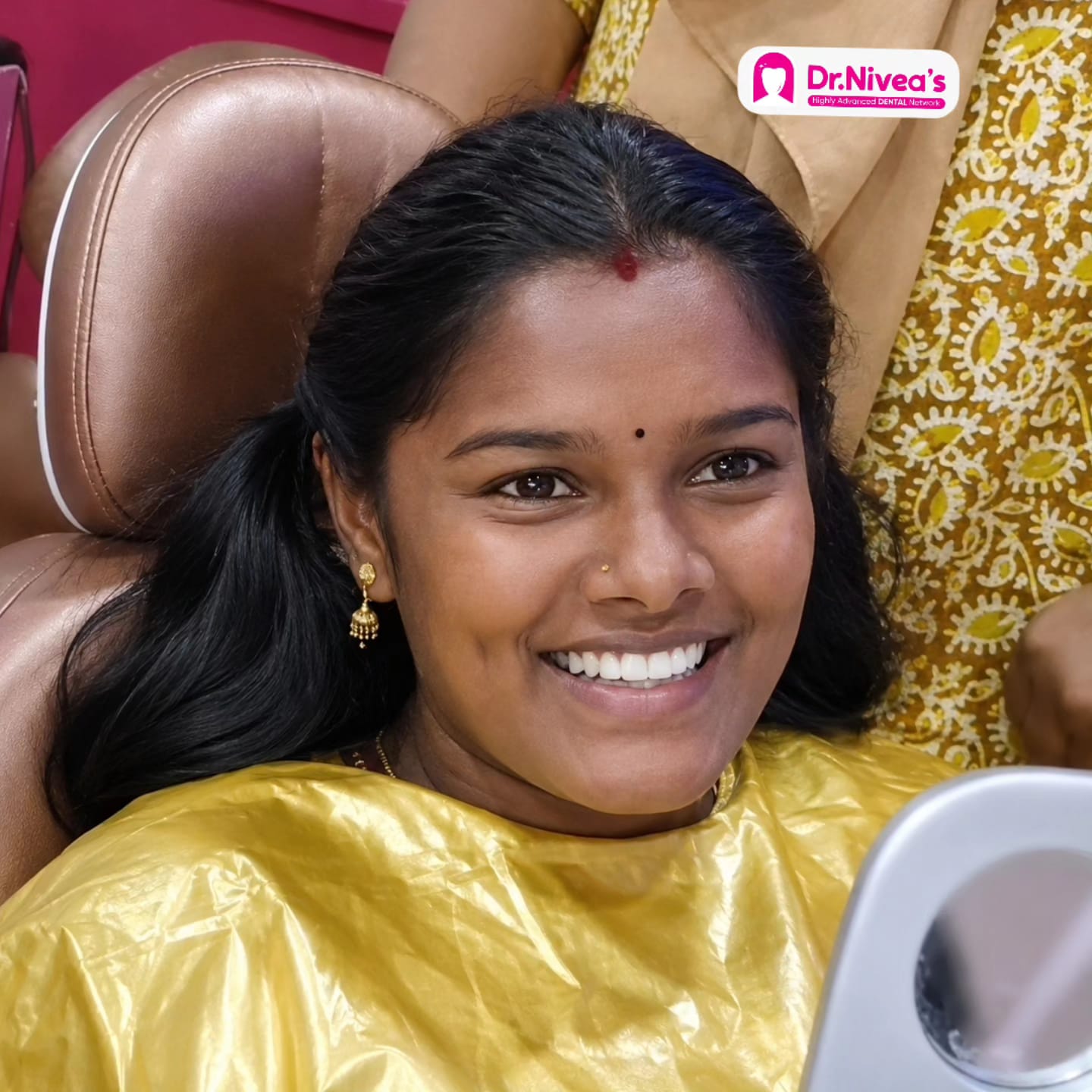 Patient's bright, aligned smile after treatment at Dr. Nivea's Advanced Dental Network